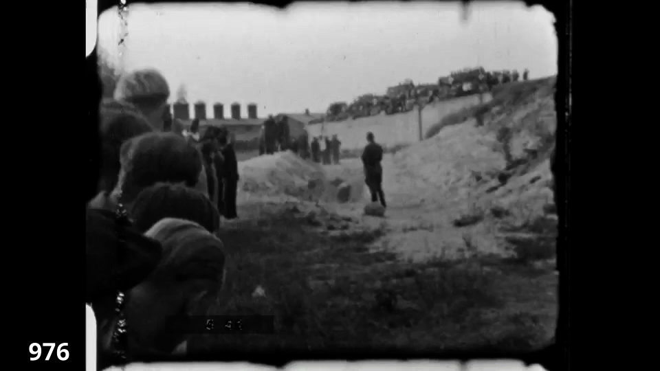 Screenshot from the Wiener Film mass execution in Liepaja 1942 fc 0976 - Execution, Jews being shot in pit, bystanders